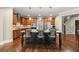Eat in kitchen features a large center island with granite countertops, stainless appliances, and breakfast bar at 8920 Ellesmere Dr, Cumming, GA 30041