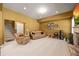 Carpeted living room with a stone fireplace, recessed lighting, and comfortable leather seating at 8920 Ellesmere Dr, Cumming, GA 30041