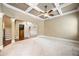 Open-concept living room showcasing a staircase and seamless flow to other areas of the home at 8920 Ellesmere Dr, Cumming, GA 30041