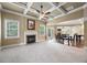 Bright and airy living room with a fireplace, neutral carpet, and a seamless transition to the dining area at 8920 Ellesmere Dr, Cumming, GA 30041