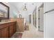 The primary bathroom boasts double vanities, a soaking tub, and a glass enclosed shower at 8920 Ellesmere Dr, Cumming, GA 30041