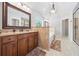 This primary bathroom features dual vanities, a soaking tub, and a sleek glass-enclosed shower at 8920 Ellesmere Dr, Cumming, GA 30041