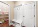 Mud room features a built in bench with access to pantry, garage, and closet space at 8920 Ellesmere Dr, Cumming, GA 30041