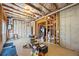 Unfinished basement with exposed ceiling featuring concrete walls and floor at 8920 Ellesmere Dr, Cumming, GA 30041