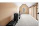 The carpeted walk-in closet has hanging rods and shelving at 8920 Ellesmere Dr, Cumming, GA 30041