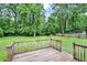 Fenced in backyard featuring a green lawn and wooded perimeter at 132 Bishop Nw Rd, Cartersville, GA 30121