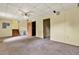 Unfinished basement featuring a concrete floor, yellow paneled walls, and drop ceiling at 132 Bishop Nw Rd, Cartersville, GA 30121