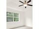Bedroom with ceiling fan, carpet, and windows bringing in natural light at 132 Bishop Nw Rd, Cartersville, GA 30121