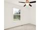 Bedroom featuring a ceiling fan and window overlooking a green outdoor view at 132 Bishop Nw Rd, Cartersville, GA 30121