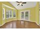 Bright dining area with hardwood floors and large windows overlooking the backyard at 132 Bishop Nw Rd, Cartersville, GA 30121