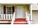 Close-up of a front porch featuring freshly painted steps, railings and a bright white front door at 132 Bishop Nw Rd, Cartersville, GA 30121