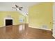 Bright living room with hardwood floors, a fireplace, and lots of natural light at 132 Bishop Nw Rd, Cartersville, GA 30121