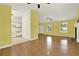 Bright living room with hardwood floors, fireplace, and view into the kitchen area at 132 Bishop Nw Rd, Cartersville, GA 30121