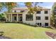 This home features a covered back porch with multiple windows, great for entertaining at 3292 Lenox Ne Pl, Atlanta, GA 30324