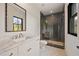 Modern bathroom with marble floors, double sink vanity, and glass-enclosed shower at 3292 Lenox Ne Pl, Atlanta, GA 30324