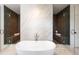Contemporary bathroom featuring a freestanding tub nestled between two glass-enclosed showers at 3292 Lenox Ne Pl, Atlanta, GA 30324