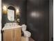 Elegant powder room with dark walls, marble vanity, and stylish lighting at 3292 Lenox Ne Pl, Atlanta, GA 30324