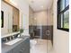 Modern bathroom with sleek vanity, glass enclosed shower, and natural light at 3292 Lenox Ne Pl, Atlanta, GA 30324