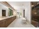 Bright bathroom featuring double vanity, soaking tub and glass enclosed shower at 3292 Lenox Ne Pl, Atlanta, GA 30324