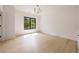Bright bedroom with hardwood floors and a large window at 3292 Lenox Ne Pl, Atlanta, GA 30324