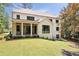 Beautiful home exterior with a covered patio and lush landscaping, perfect for outdoor living at 3292 Lenox Ne Pl, Atlanta, GA 30324