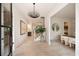 Bright foyer with chandelier, light wood floors, and views into other rooms at 3292 Lenox Ne Pl, Atlanta, GA 30324