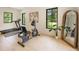 Home gym with treadmill, stationary bike, wood floors, and abundant natural light at 3292 Lenox Ne Pl, Atlanta, GA 30324