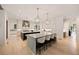 Large kitchen with double islands, custom cabinetry, marble countertops, and bar stool seating at 3292 Lenox Ne Pl, Atlanta, GA 30324
