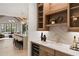 A kitchen featuring custom wood cabinetry, a wine refrigerator, and stylish decor at 3292 Lenox Ne Pl, Atlanta, GA 30324