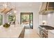 A gourmet kitchen with designer lighting, marble countertops, and professional-grade appliances at 3292 Lenox Ne Pl, Atlanta, GA 30324