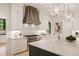 Well-equipped kitchen featuring marble countertops, stainless steel appliances, and custom cabinetry at 3292 Lenox Ne Pl, Atlanta, GA 30324