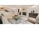 Bright living room with fireplace, modern furnishings, and light hardwood floors at 3292 Lenox Ne Pl, Atlanta, GA 30324