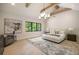Bright and airy main bedroom with vaulted ceilings, a sitting area, and a picture window at 3292 Lenox Ne Pl, Atlanta, GA 30324