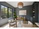 Stylish home office featuring built-in shelving, a large window and comfortable seating at 3292 Lenox Ne Pl, Atlanta, GA 30324