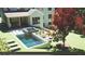A backyard featuring a refreshing pool, hot tub, lounge chairs, and covered patio at 3292 Lenox Ne Pl, Atlanta, GA 30324