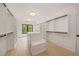 Spacious walk-in closet with custom shelving and a center island at 3292 Lenox Ne Pl, Atlanta, GA 30324