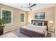 Cozy bedroom features soft, natural light and a ceiling fan at 4837 Mystere Sw Cir, Lilburn, GA 30047