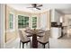 Cozy breakfast nook with a bay window, table with seating, and access to the backyard at 4837 Mystere Sw Cir, Lilburn, GA 30047
