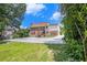 Large home with lush green lawn and ample parking at 4837 Mystere Sw Cir, Lilburn, GA 30047