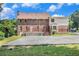 Spacious backyard with a deck and large concrete driveway at 4837 Mystere Sw Cir, Lilburn, GA 30047