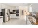 Modern kitchen boasting stainless steel appliances, granite countertops, and white cabinetry at 4837 Mystere Sw Cir, Lilburn, GA 30047