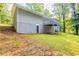 Exterior view showcases the house's backyard, deck, and yard at 6662 Birchwood Ct, Winston, GA 30187