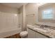 Bathroom featuring a tub with shower, granite countertop, and wood floors at 6662 Birchwood Ct, Winston, GA 30187
