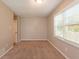 This bedroom features neutral paint, carpet flooring, and natural light from the windows with white blinds at 6662 Birchwood Ct, Winston, GA 30187