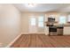 Well-lit kitchen featuring stainless steel appliances, granite countertops, and white cabinets at 6662 Birchwood Ct, Winston, GA 30187