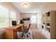Bright and functional home office featuring a desk, comfortable chair, ample natural light, and built-in shelving at 6662 Birchwood Ct, Winston, GA 30187