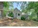 Backyard view of home with stairs to deck and lush green lawn at 13935 Brown Bridge Rd, Covington, GA 30016