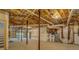 Unfinished basement featuring exposed ceiling, support beams, and mechanical equipment at 13935 Brown Bridge Rd, Covington, GA 30016