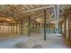 Unfinished basement featuring exposed ceiling and support beams, ready to be customized at 13935 Brown Bridge Rd, Covington, GA 30016