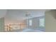 A bright bonus room is well-lit from two windows, and overlooks a lower room at 13935 Brown Bridge Rd, Covington, GA 30016